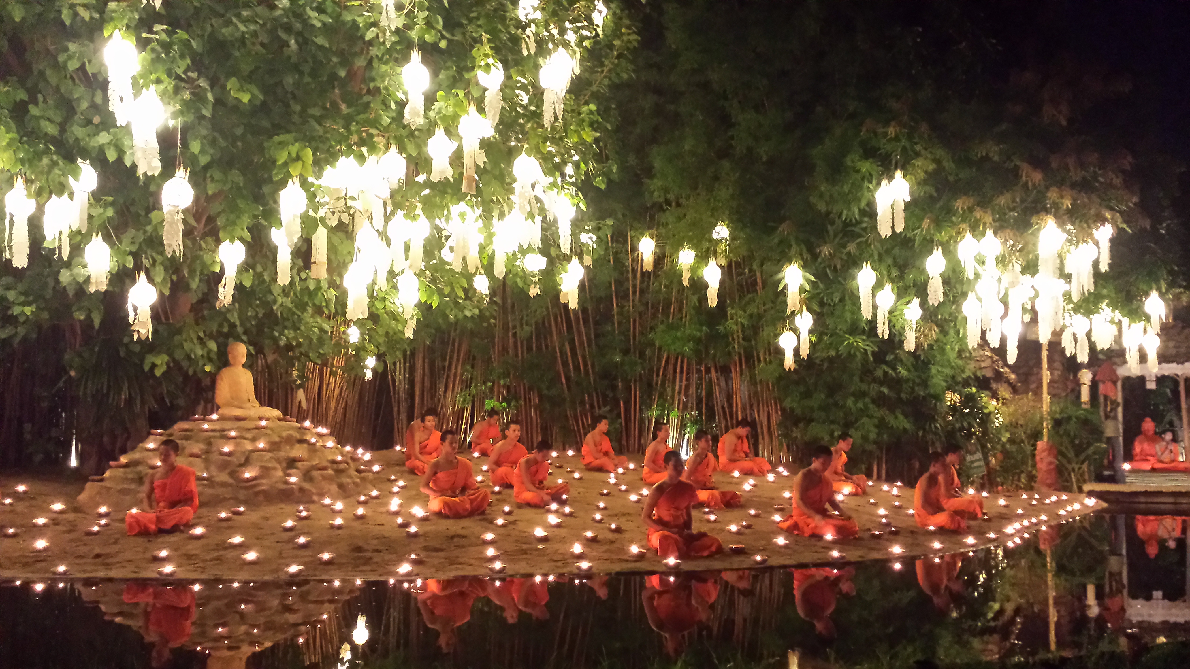 the-traditional-winner-watching-the-monks-chant-during-loi-krathong-in-chaing-mai